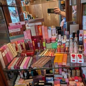 Assorted Lipsticks and Makeup Collection